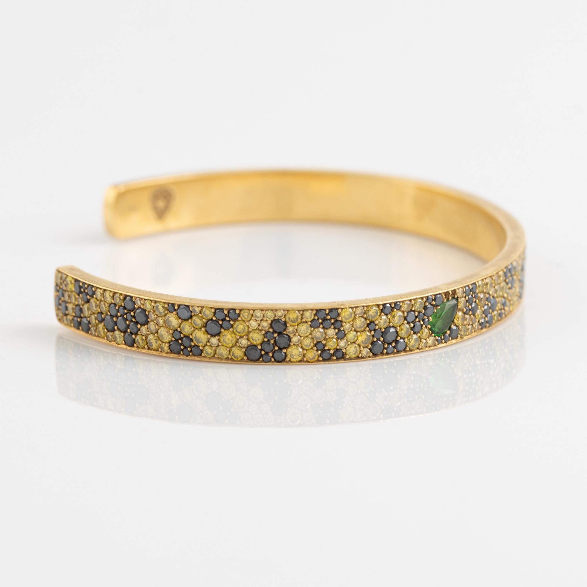 Crow's nest jewels, gold, black and yellow diamond and pear shaped tsavorite bangle.