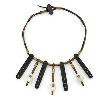 500. Vivianna Torun Bülow-Hübe, a necklace, wood, leather, mother-of-pearl and brass, most likely 1950's.