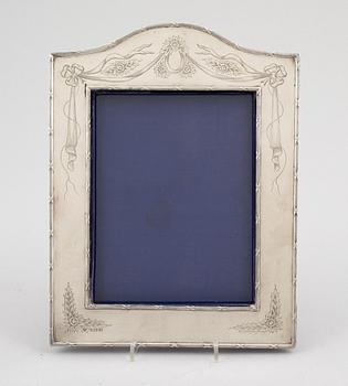 A silver picture frame by Richard Martin, Ebenezer Hall & Co. Birmingham, England, 1905.