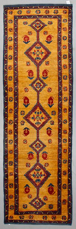 An oriental runner, ca 305 x 94 cm.