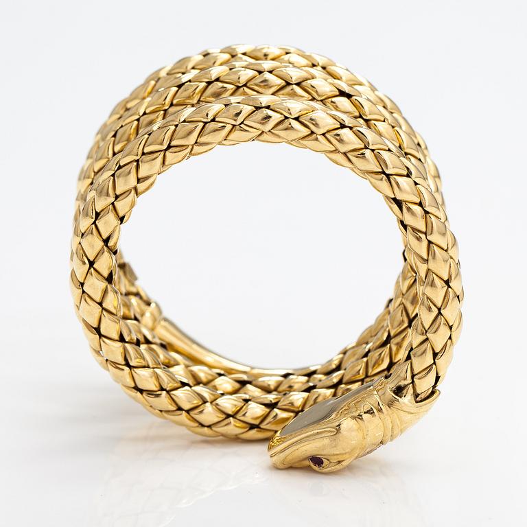Chimento, An 18K gold snake bracelet with rubies and diamonds ca. 0.46 t in total. Italy.