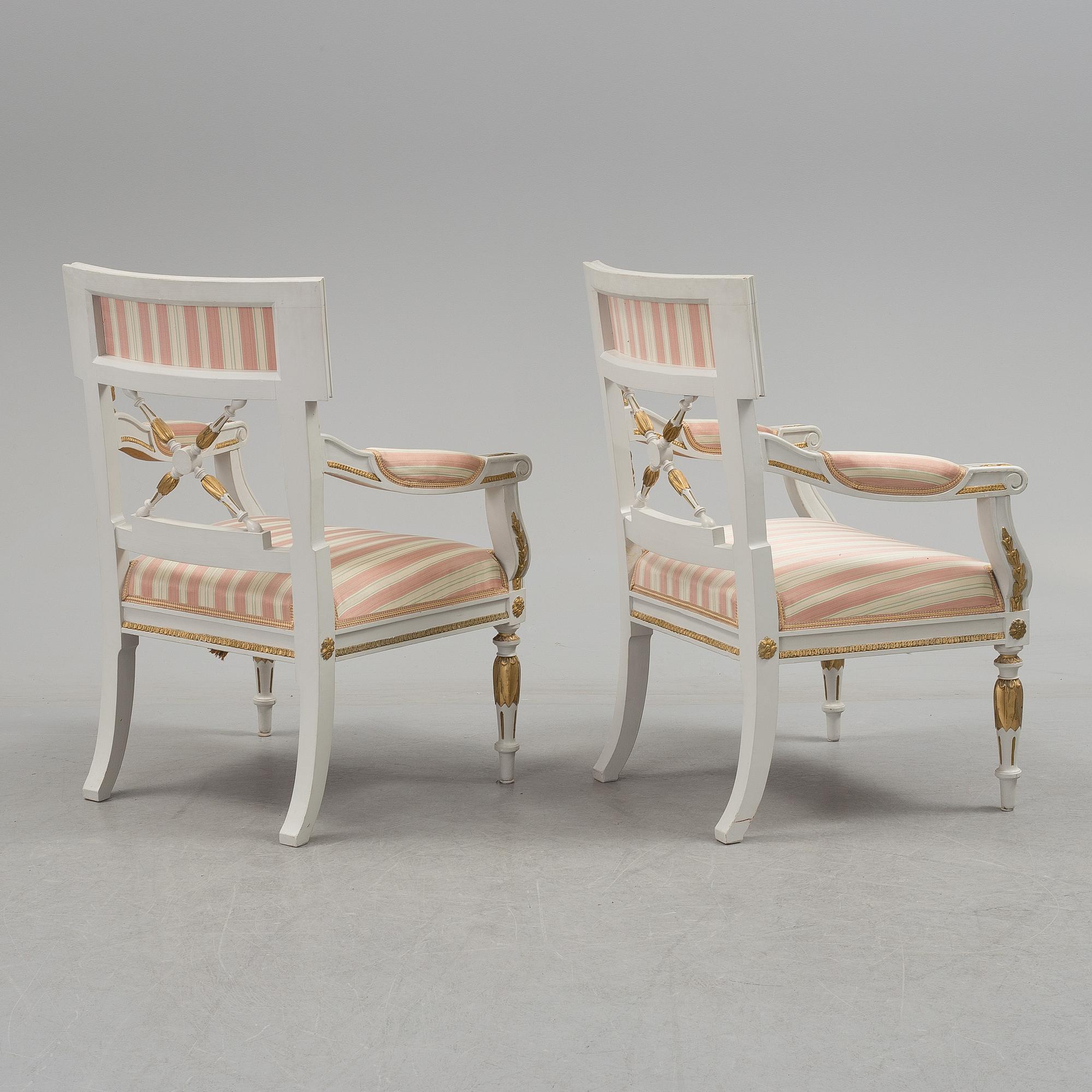 A set of two armchairs, a sofa, a stool and a chair. Early 20th century.