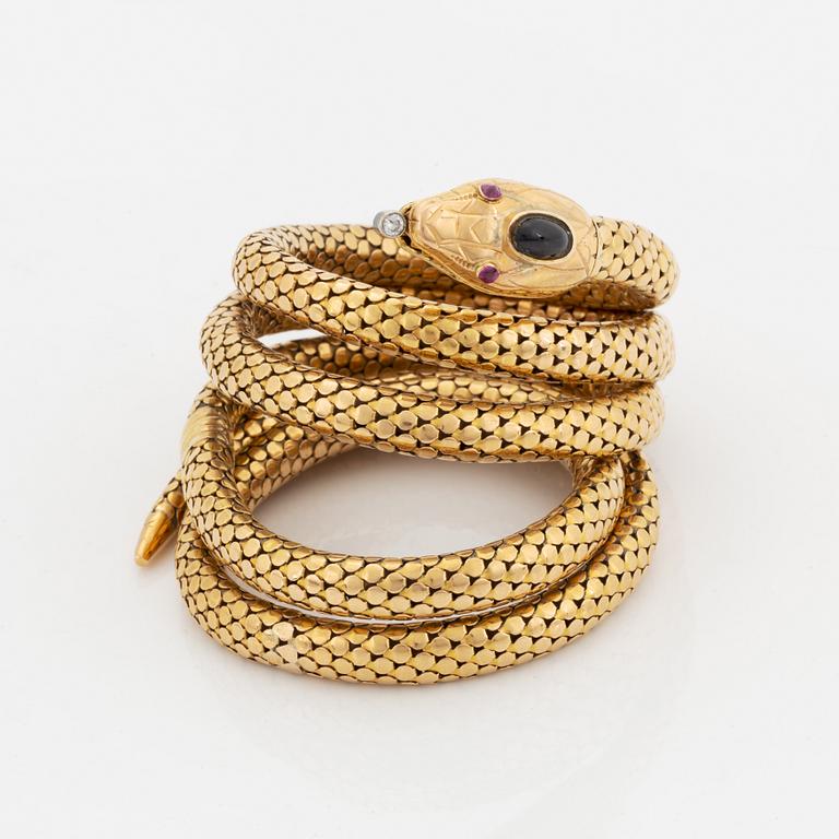 An 18K gold snake bracelet.