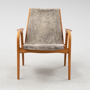 Yngve Ekström, a shearling 'Laminett' easy chair, Swedese.