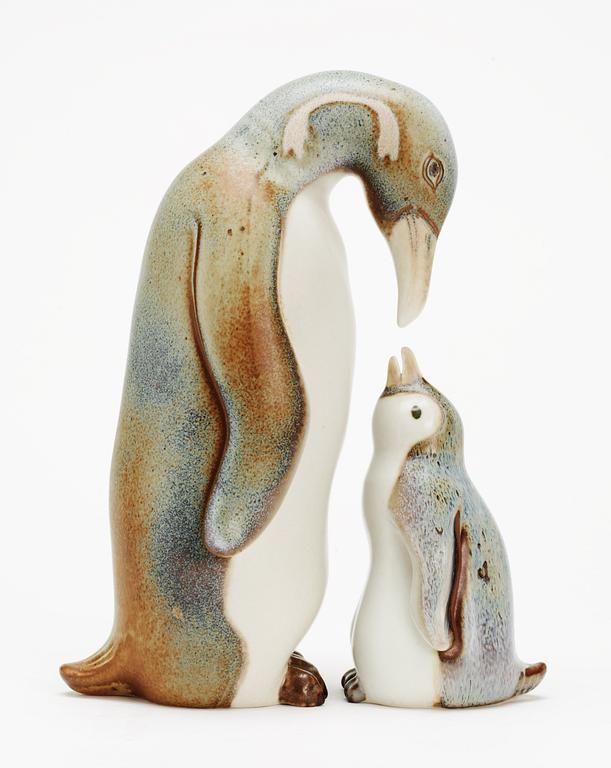 Two Gunnar Nylund stoneware figures depicting a penguin mother and child, Rörstrand.