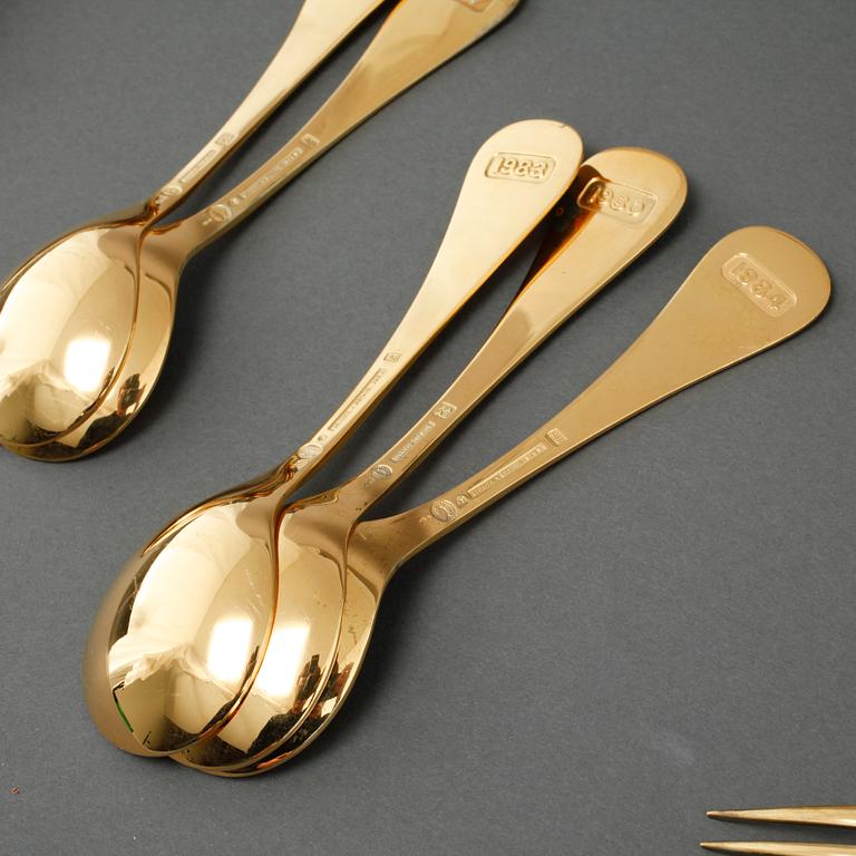 GEORG JENSEN, årsskedar, 19 st, förgyllt silver, samt årssked och gaffel, A. Michelsen, förgyllt silver, 1970-/80-tal.