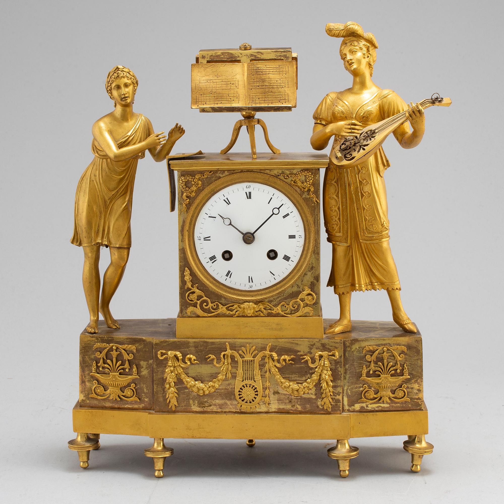 A French Empire gilt bronze mantel clock, first half of the 19th century.