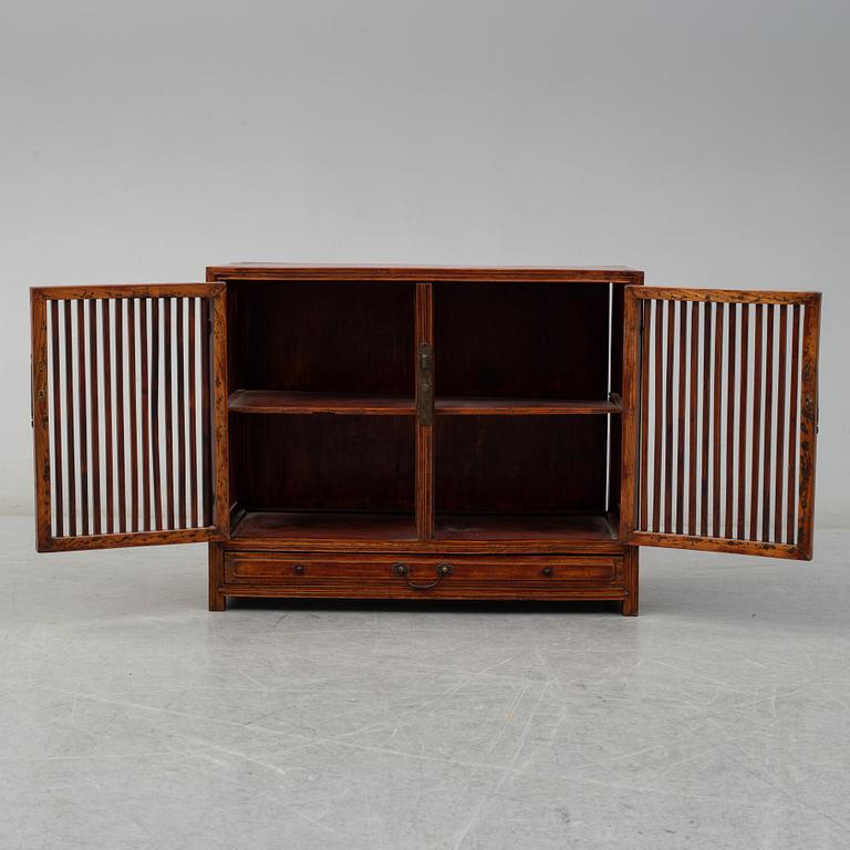 A stained second half of the 20th century cupboard from south-east Asia.