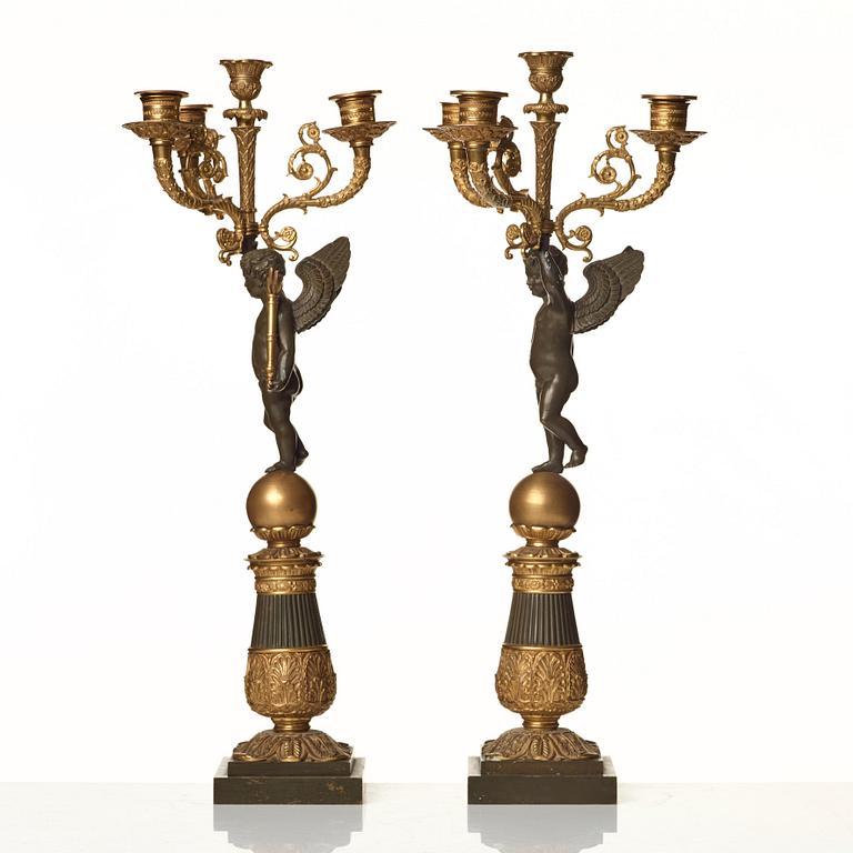 A pair of French Empire early 19th century four-light candelabra.