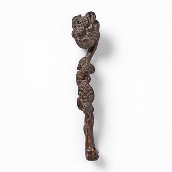 A carved wooden ruyi scepter, Qing dynasty/early Republic.