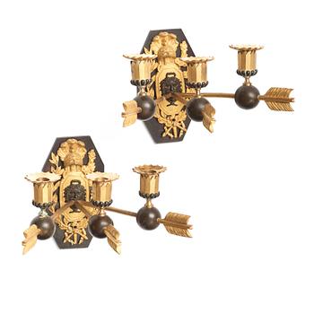 67. A pair of Empire three-light wall-lights, early 19th century Stockholm or St Petersburg.