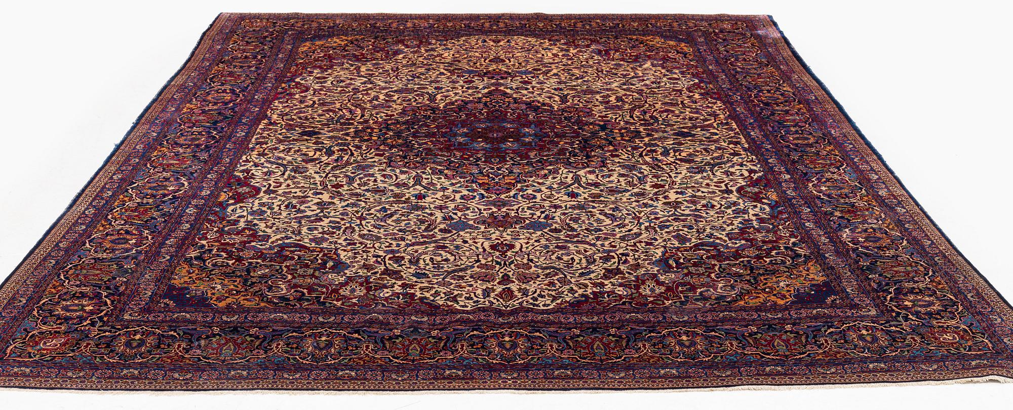 An antique silk Kashan carpet, central Persia (Iran) c. 378 x 259 cm.