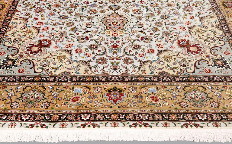 A part silk Tabriz carpet, so-called 50 Raj, approx. 348 x 252 cm.