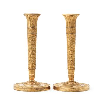 60. A pair of Empire candlesticks.