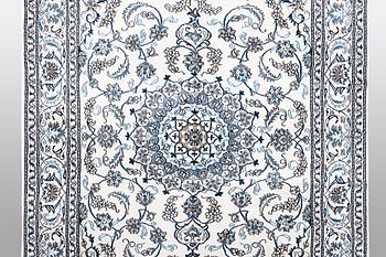 A carpet, Nain, 285 x 196 cm.