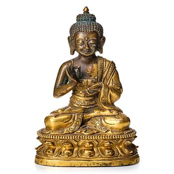 868. A partly gilt Tibeto-Chinese figure of Maitreya Buddha, 17th century.