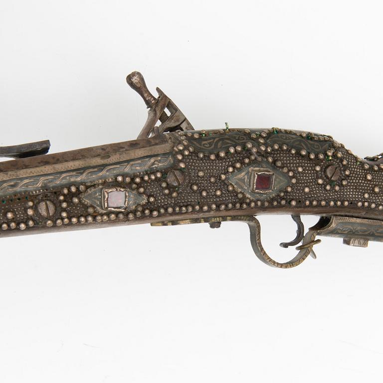 A 19th Century North African flint lock rifle.