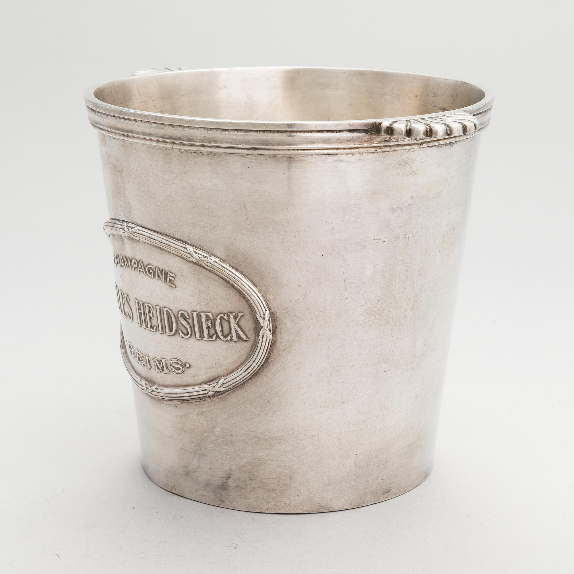 A silver plated brass Charles Heidsieck Champagne cooler.