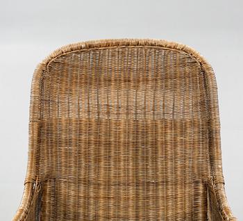 A rattan arm chair from the second half of the 20th century.