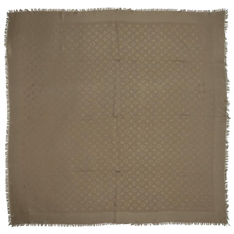 LOUIS VUITTON, a olive green monogrammed wool and silk shawl.