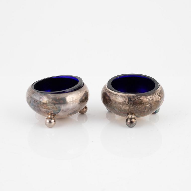 Eight salt cellars and shakers, silver and other white metal, England, 1800-1908.
