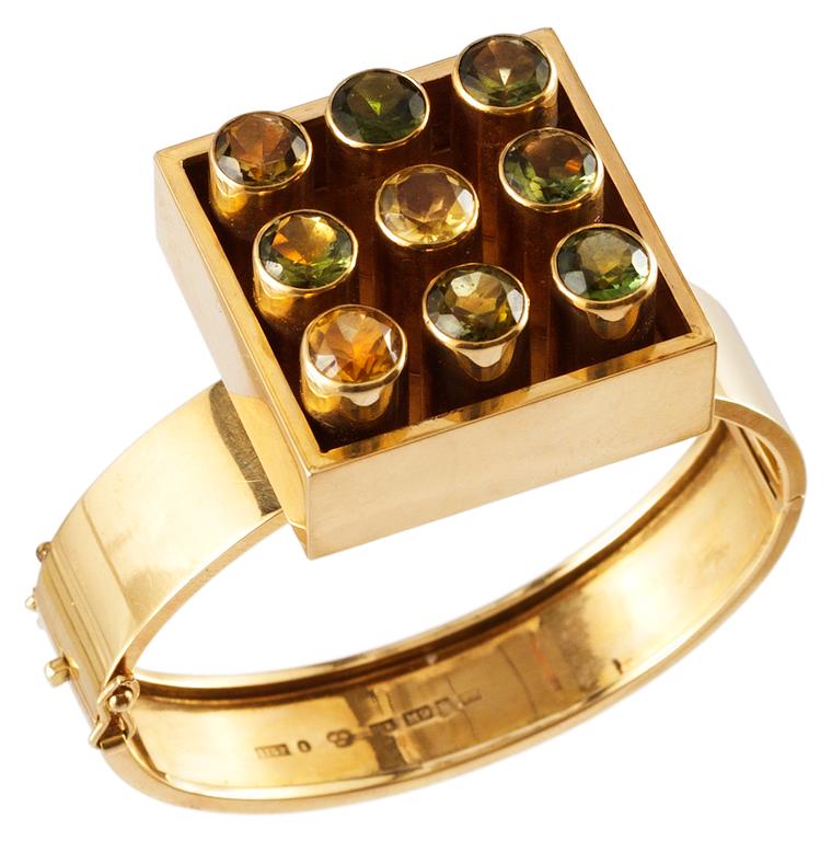A Sigurd Persson 18k gold bangle with turmalines and citrines, Stockholm 1961.