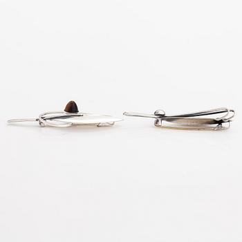 Elis Kauppi, Two silver brooches, one with a tiger's eye. Kupittaan kulta, Turku 1959 and 1962.