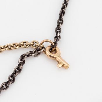 A necklace by Ole Lynggaard, the clasp decorated with a diamond.