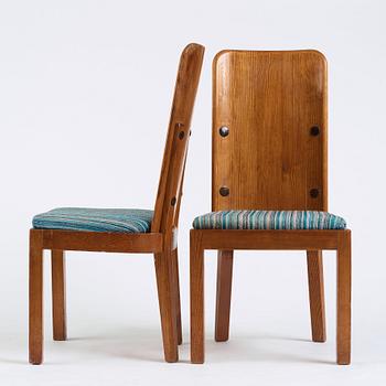 Axel Einar Hjorth, a pair of stained pine "Lovö" chairs, Nordiska Kompaniet, Sweden 1930's.