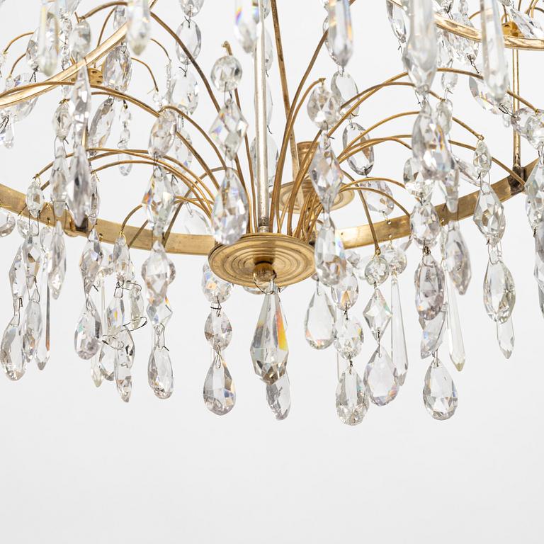A Gustavian four-branch gilt-brass chandelier, Stockholm, late 18th century.
