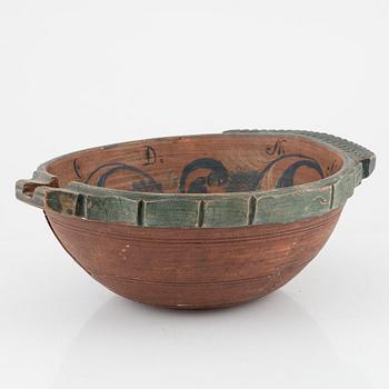 A lathed and painted bowl dated 1783.