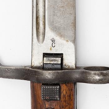 Three Swedish bayonets with scabbards.