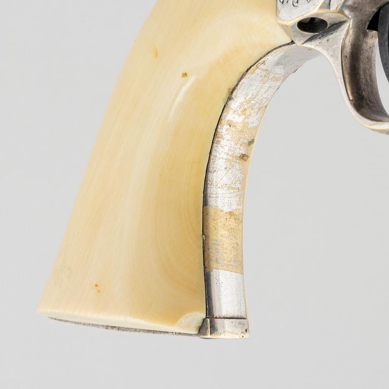 A percussion revolver, Colt 1851 Navy, in case, from the year 1863.