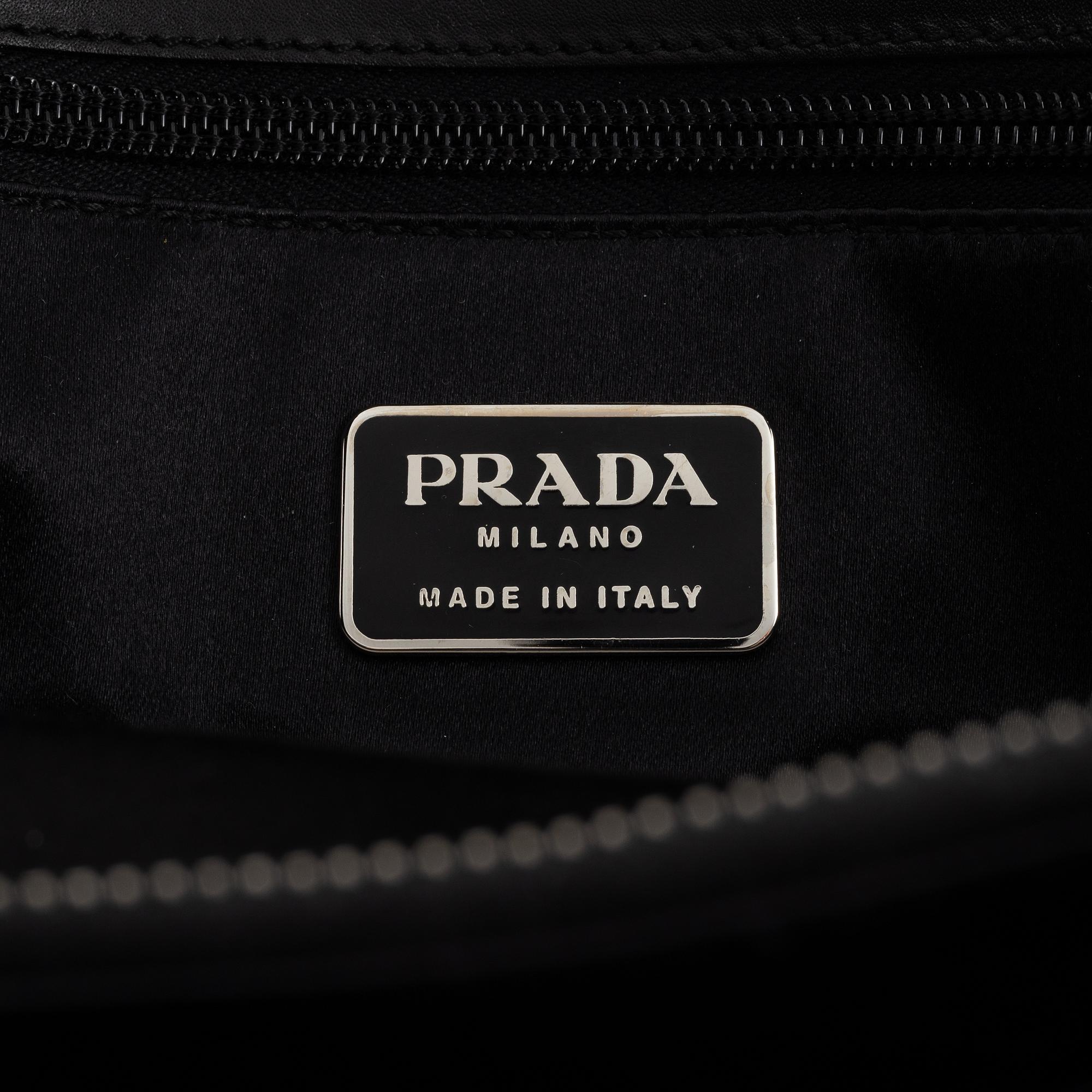 Prada, a black leather bag.