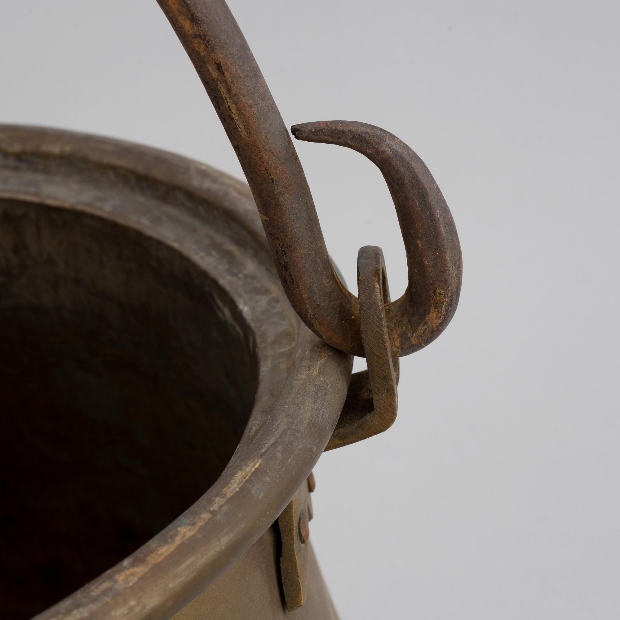 A large 18th century brass cauldron.