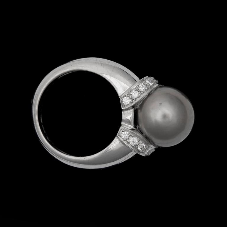 A cultured Tahiti pearl ring with brilliant cut diamonds.