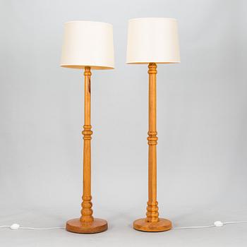 Two 1960/70s pine wood floor lamps.