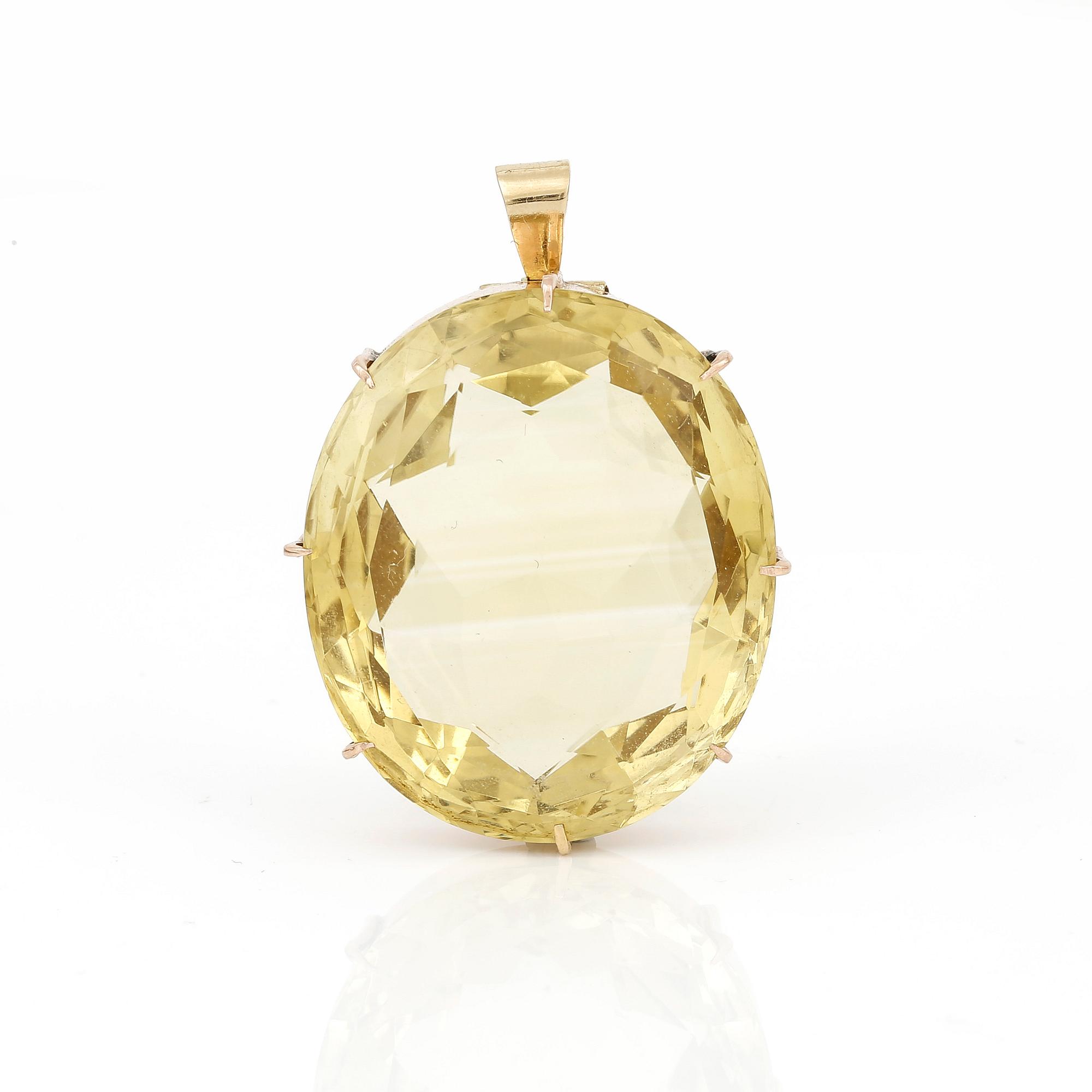 HÄNGE, 15K guld med oval facetterad citrin, ca 85,37 ct. Vikt ca 24,19 g.