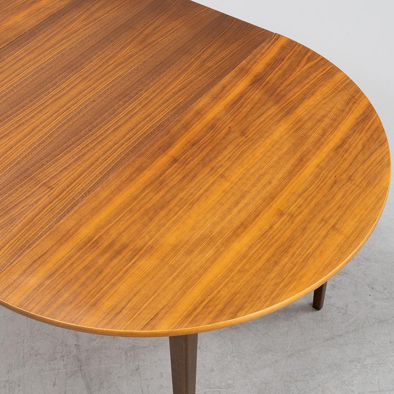 A walnut dining table, 1960's.