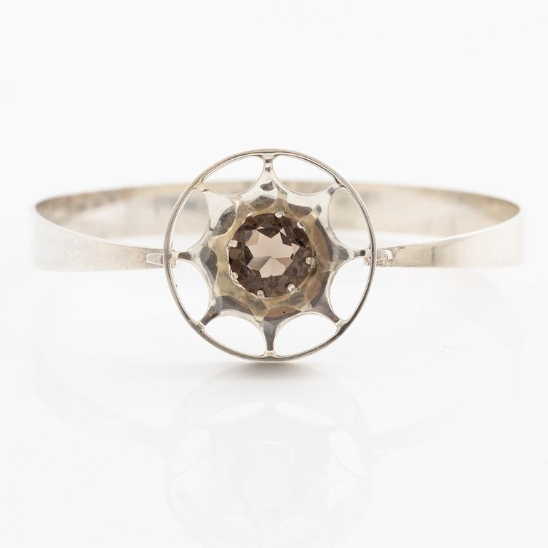 Arm ring and brooch, silver with smoky quartz, Kultasepät Salovaara.