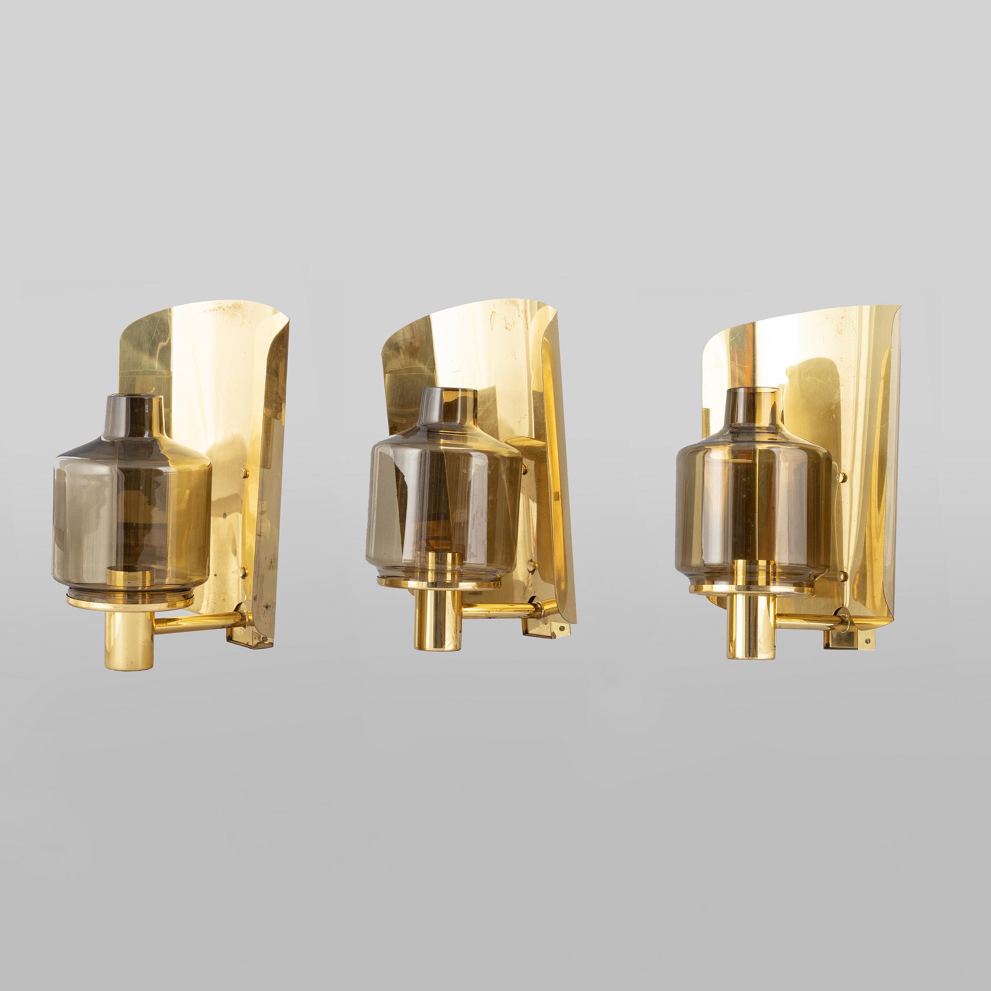 Hans-Agne Jakobsson, three brass wall light sconces, Markaryd, 1960's.