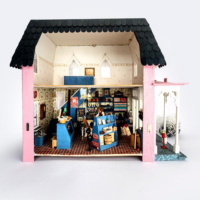 A handmade dolls house later part of the 20th century.