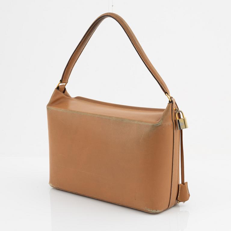 Hermès, a vintage tan leather bag, mid 20th century.