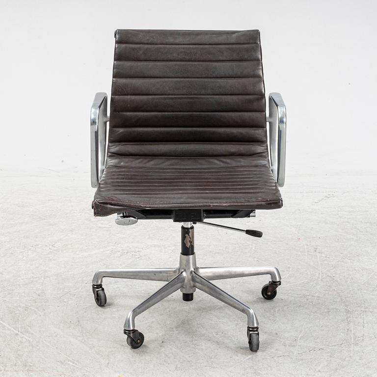 An EA 118 swivel office chair by Charles and Ray Eames for Herman Miller.