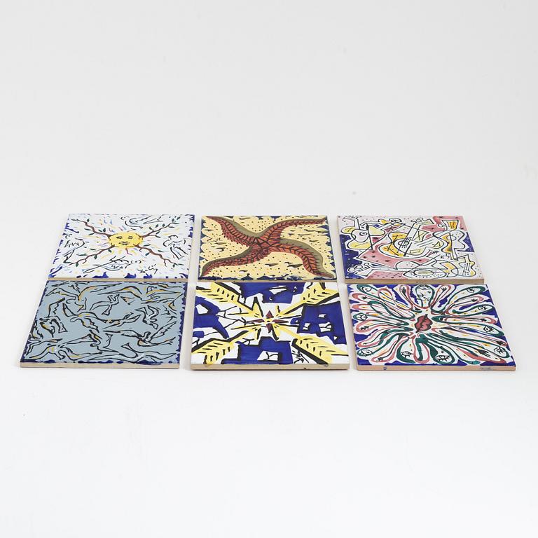 A set of six earthenware tile plates, after Salvador Dalí, late 20th century.