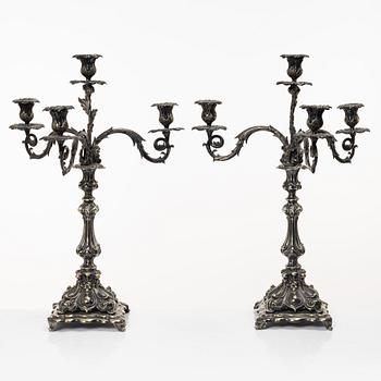 A pair of silver plated Rococo style candelabra, 20th century.