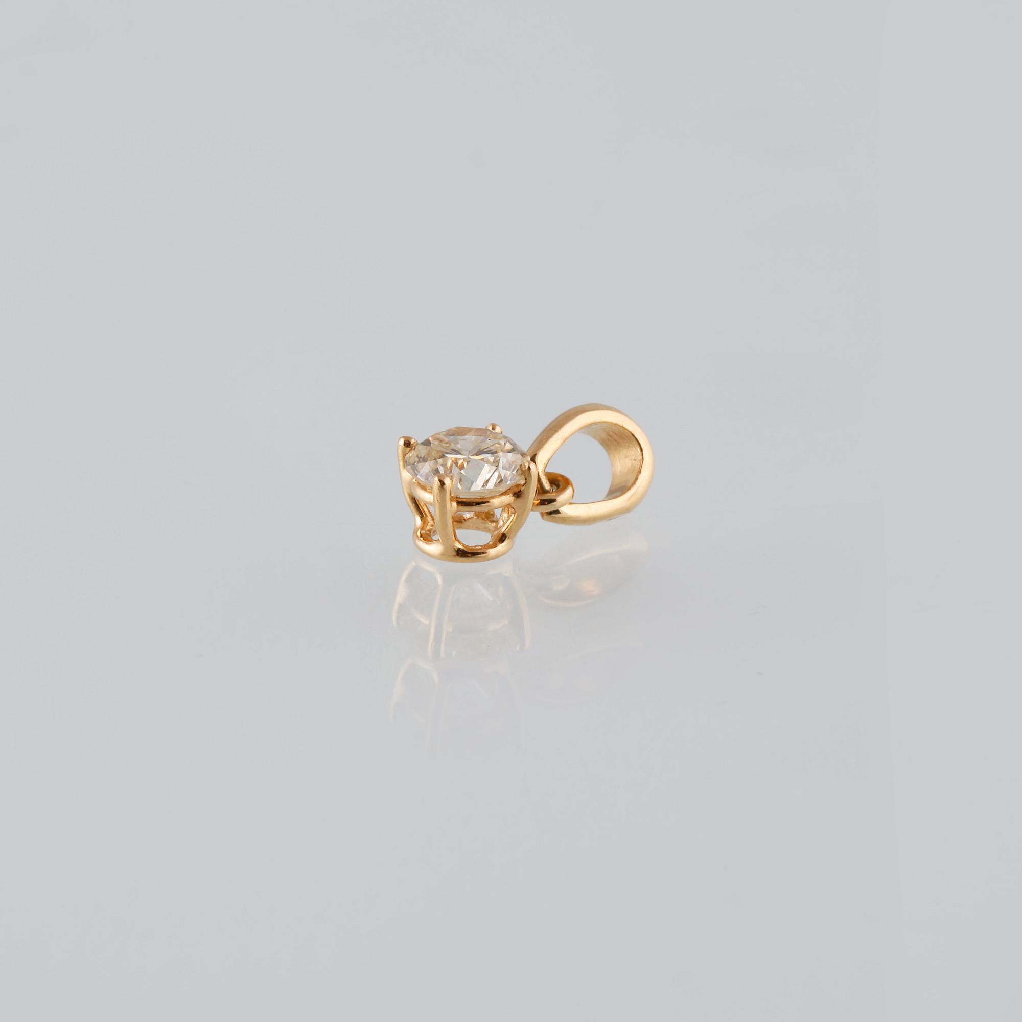 HÄNGE, 18K guld med briljantslipad diamant 0.50 ct. Vikt 0,6 gram.