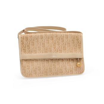 CHRISTIAN DIOR, a beige monogram canvas evening bag.