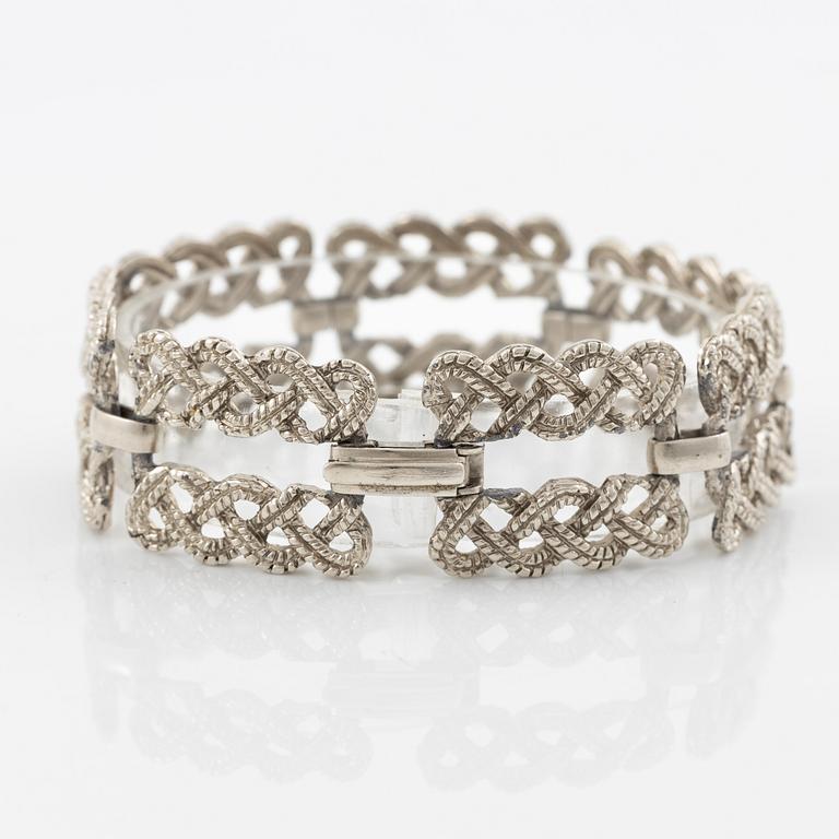 Armband vit metall.