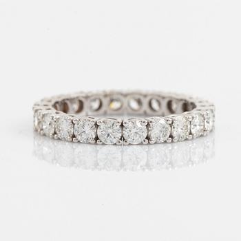 Brilliant cut diamond eternity ring.